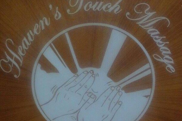 blurry picture of massaging hands with Heaven's Touch Massage written on top